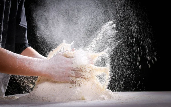 Making dough by female hands at home in kitchen — Stock Photo, Image