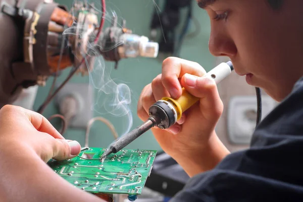 Repair of electronic devices, tin soldering parts — Stock Photo, Image