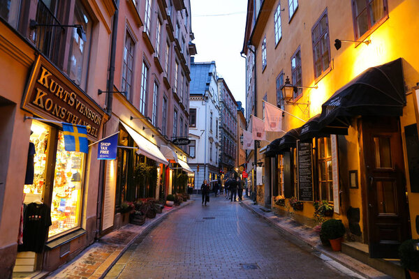 STOCKHOLM, SWEDEN - SEPTEMBER 20, 2017: Old and narrow street in Gamla Stan, old town of Stockholm city