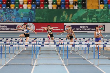 ISTANBUL, TURKEY - FEBRUARY 02, 2020: Athletes running 60 metres hurdles during Turkish Indoor Athletics Championships