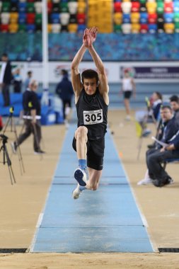 ISTANBUL, TURKEY - FEBRUARY 02, 2020: Undefined athlete triple jumping during Turkish Indoor Athletics Championships