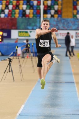 ISTANBUL, TURKEY - FEBRUARY 02, 2020: Undefined athlete triple jumping during Turkish Indoor Athletics Championships