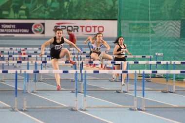 ISTANBUL, TURKEY - FEBRUARY 02, 2020: Athletes running 60 metres hurdles during Turkish Indoor Athletics Championships