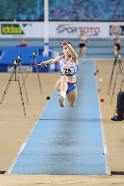 ISTANBUL, TURKEY - FEBRUARY 09, 2020: Undefined athlete triple jumping during Balkan U20 Athletics Indoor Championships