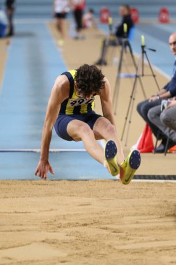 İSTANBUL, TURKEY - 29 Şubat 2020 Ruhi Sarialp Atlama Yarışmaları sırasında uzun atlama yapan tanımlanamayan sporcu