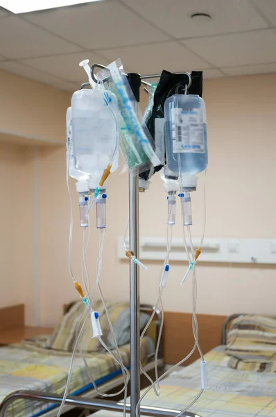 Prepared systems for intravenous administration of drugs on a rack in a hospital ward
