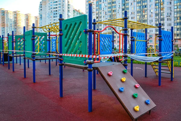Children\'s playground is closed. Ban tape. Prevention of coronavirus COVID-19. Copy space. Krasnogorsk, Moscow region, Russia