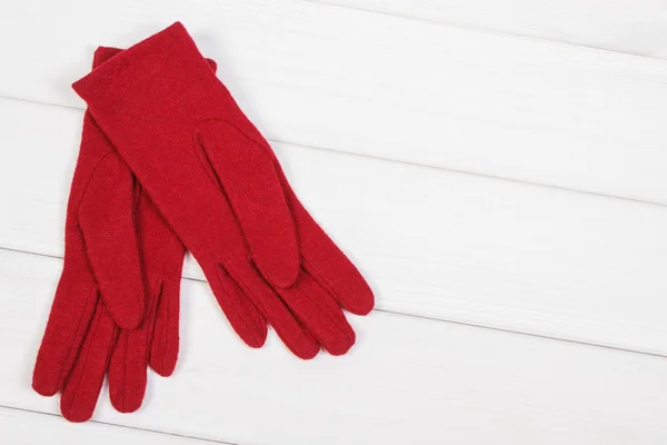 Gloves for woman on boards, clothing for autumn or winter, copy space for text — Stock Photo, Image