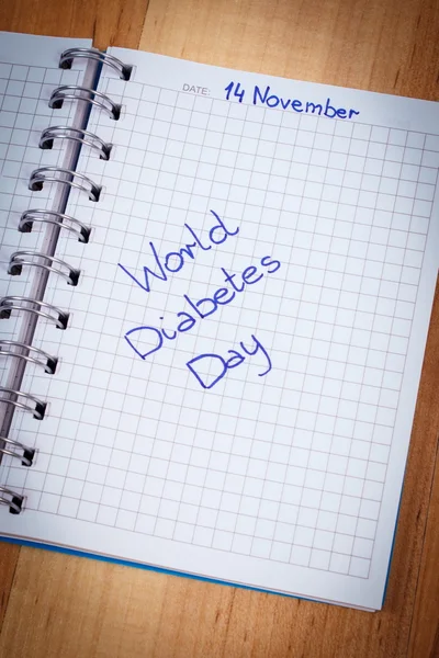 Wereld diabetes dag geschreven in notebook — Stockfoto