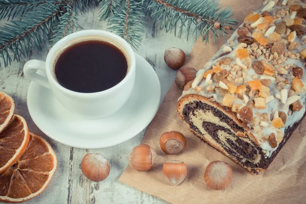 Vintage photo, Poppy seeds cake, cup of coffee and spruce branches, dessert for Christmas