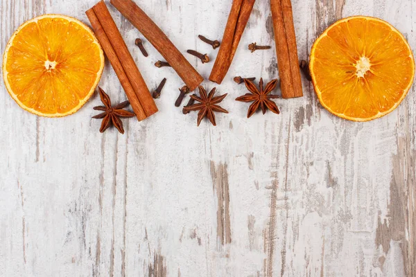 Dried orange with spices on old wooden background, christmas decoration — Stock Photo, Image