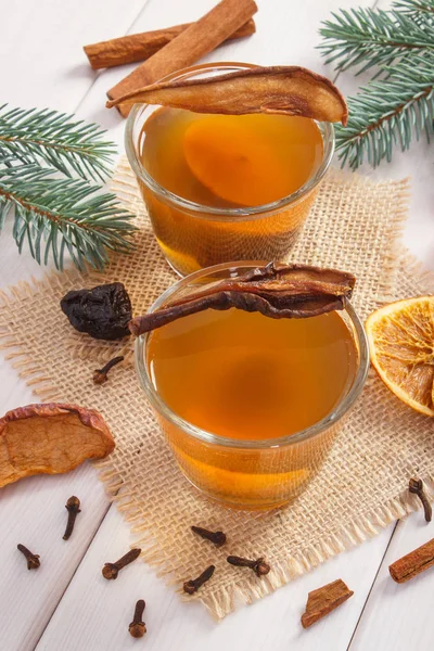 Spruce branches and traditional compote of dried fruits for Christmas — Stock Photo, Image