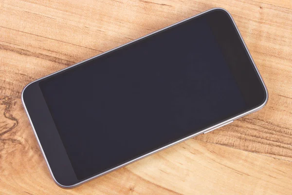 Mobile phone with blank screen on table, smartphone — Stock Photo, Image