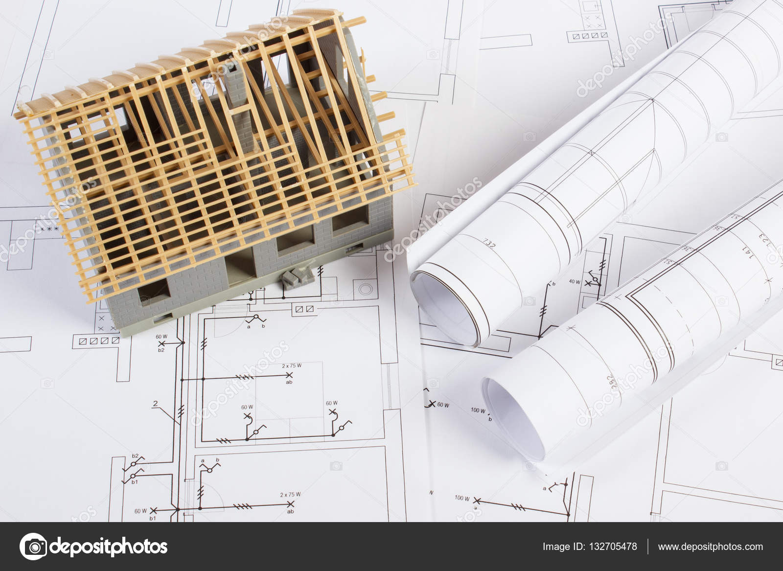 Small House Under Construction On Electrical Drawings For Project, Concept  Of Building Home Stock Photo, Picture and Royalty Free Image. Image  63897025.