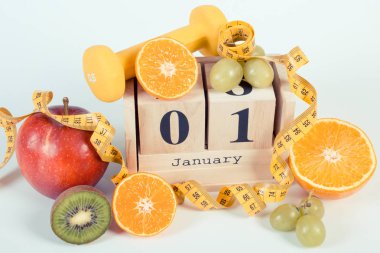 Vintage Fotoğraf, küp takvim, meyve, halter ve şerit metre, yeni yıl kararları