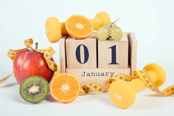 Photo vintage, Calendrier cube, fruits, haltères et ruban à mesurer, résolutions de nouvelles années — Photo