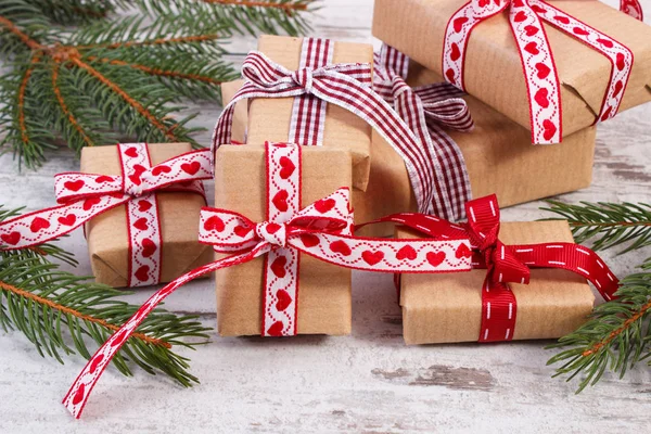 Wrapped gifts and spruce branches for Christmas or Valentines — Stock Photo, Image
