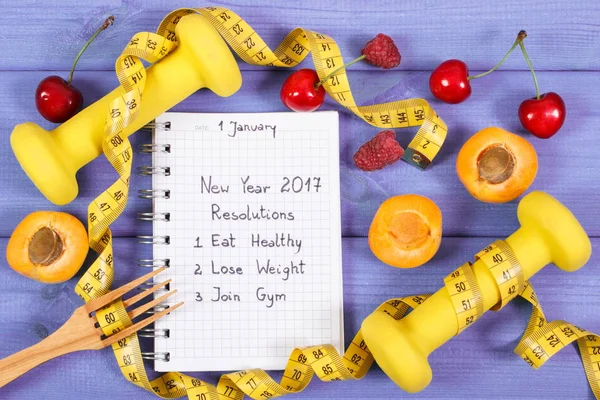 New year resolutions written in notebook on board