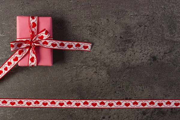Wrapped gift with ribbon for Valentines Day, copy space for text Stock Image