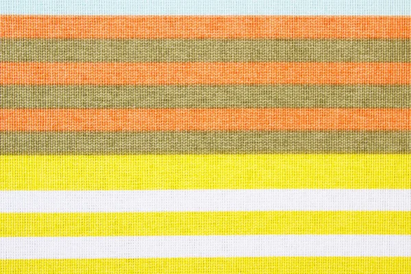 Colorful striped tablecloth as background — Stock Photo, Image