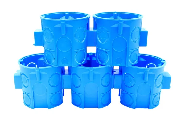 Montón de cajas eléctricas azules sobre fondo blanco — Foto de Stock