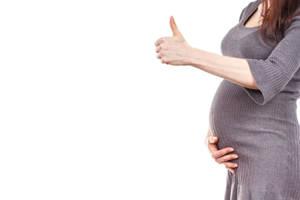 Zwangere vrouw duimen opdagen, verwachten voor baby — Stockfoto