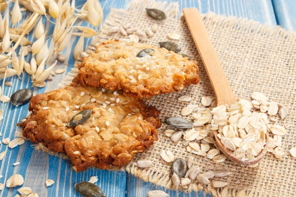 Oatmeal cookies with ingredients for baking and ears of oat, healthy dessert concept — Stock Photo, Image