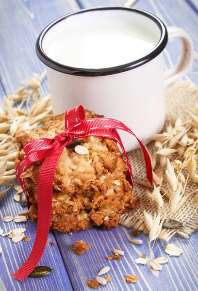 Oatmeal cookies, ingredients for baking and ears of oat, healthy dessert concept