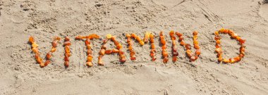 Kum plaj, yaz saati ve sağlıklı bir yaşam tarzı üzerinde yazıt vitamin D