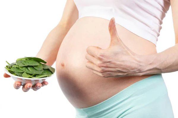 ほうれん草、妊娠中に鉄を含む健康的な栄養と妊娠中の女性 — ストック写真