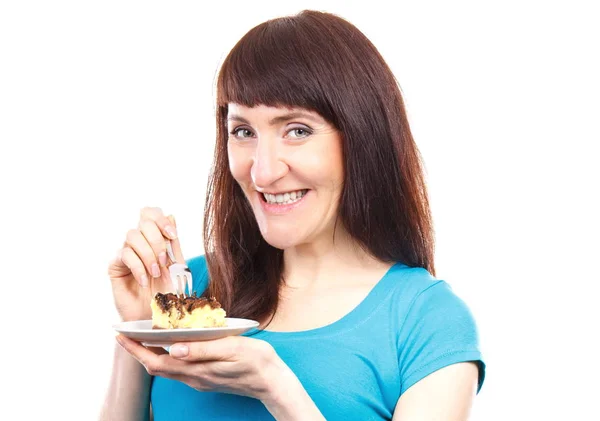 Happy woman eating fresh baked cheesecake — Stock Photo, Image