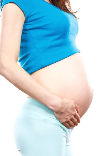 Vrouw in zwangere bedrijf hand op buik, begrip verwacht voor pasgeboren — Stockfoto