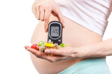 Şeker Ölçüm ve renkli şekerler, tutan hamile kadın gebelik sırasında sağlıklı beslenme