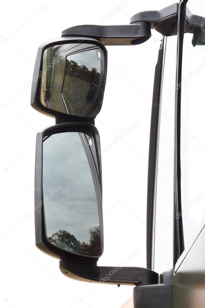 Side view mirror of truck or long vehicle, concept of safety during travel
