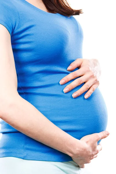 Беременная женщина с болью в животе трогает живот, боли во время беременности и риск выкидыша — стоковое фото