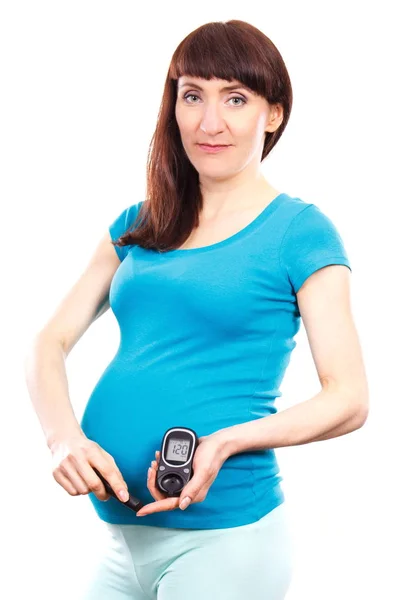 Donna felice sorridente in gravidanza con glucometro controllo del livello di zucchero, diabete durante la gravidanza — Foto Stock