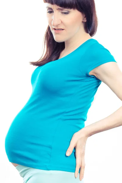 Vrouw in zwanger met handen op haar rug, zwangerschap gezondheidszorg en terug pijn concept — Stockfoto