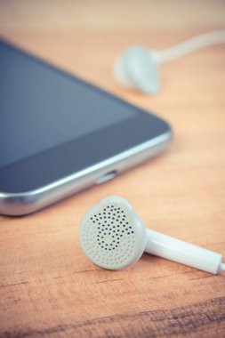 Vintage Fotoğraf, cep telefonu, kulaklık ile smartphone