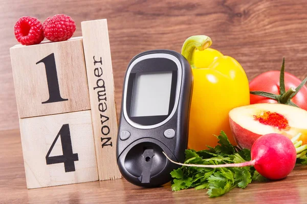 Fecha 14 Noviembre como símbolo del día mundial de la diabetes, glucómetro para medir el nivel de azúcar y frutas con verduras — Foto de Stock