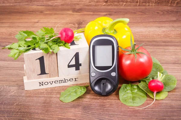 Data 14 novembre, misuratore di glucosio per il controllo del livello di zucchero e verdure, giornata mondiale del diabete e concetto di lotta contro le malattie — Foto Stock