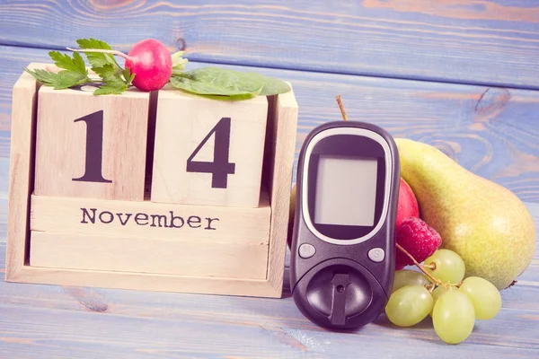 Data del 14 novembre, glucometro e frutta fresca con verdure, concetto della giornata mondiale del diabete — Foto Stock