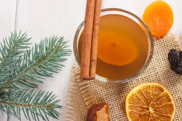 Spruce branches and compote of dried fruits for Christmas — Stock Photo, Image