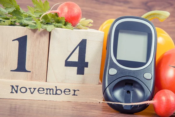 Date 14 November as symbol of world diabetes day, glucometer for measuring sugar level and vegetables — Stock Photo, Image