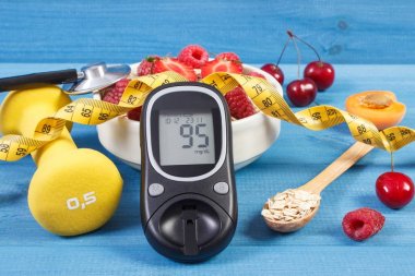 Şekeri ölçüm cihazı, taze yulaf ezmesi meyve, santimetre ve halter, sırasında diyabet şeker seviyesini kontrol kavramı