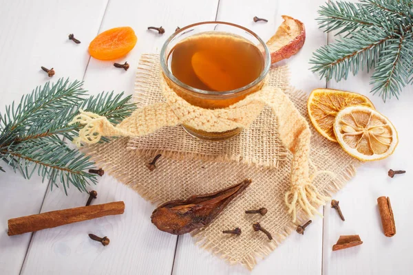 Spruce branches and traditional compote of dried fruits for festive Christmas time — Stock Photo, Image