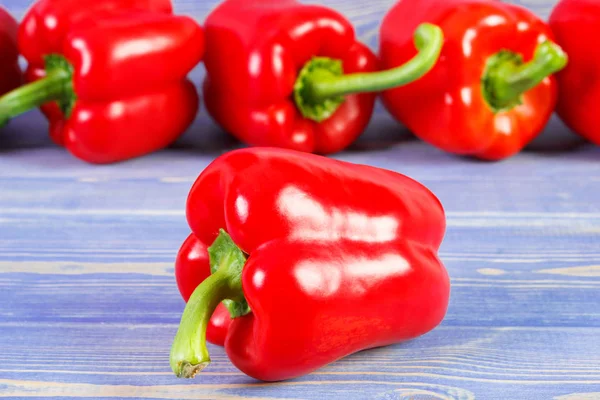 Red peppers on purple boards, healthy nutrition — Stock Photo, Image