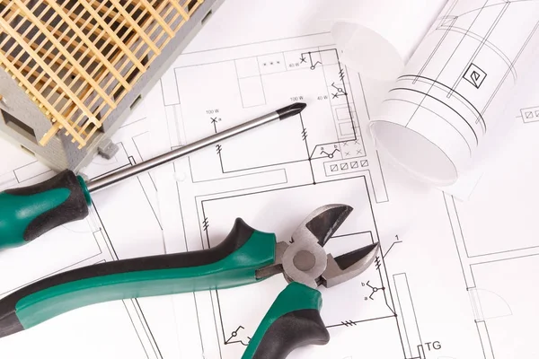 Electrical drawings, work tools and house under construction, building home concept