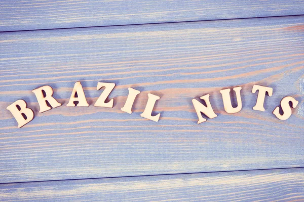 Vintage photo, Inscription brazil nuts on old boards