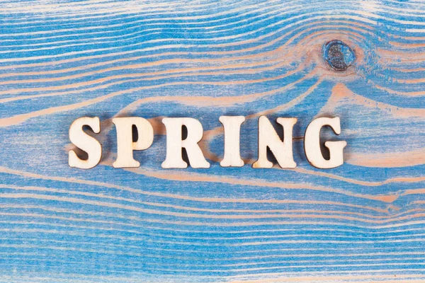 Inscription spring on old board — Stock Photo, Image