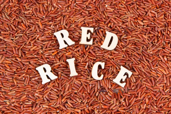 Heap of red rice as background, healthy gluten free food concept
